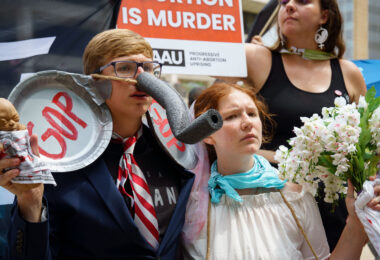 Protesters from the Progressive Anti-Abortion Uprising organization at the 2024 Republican National Convention in Milwaukee.