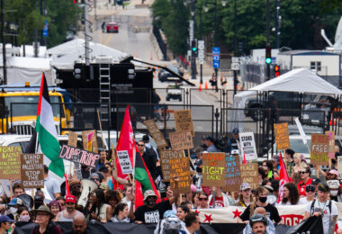 Protesters march to the secure perimeter around the 2024 Republican National Convention.