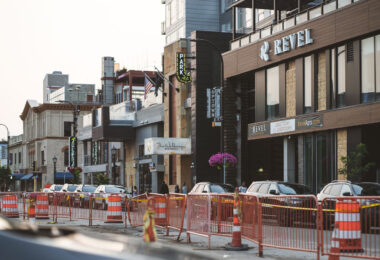 Revel apartments on Lake Street after gunshots break windows. This is one of multiple times the Uptown Minneapolis building has been behind wood following a shooting.