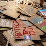 A pile of protest signs after a march around the 2024 Republican National Convention in Milwaukee.
