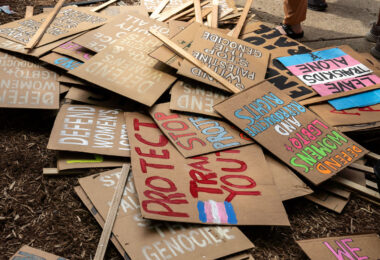 A pile of protest signs after a march around the 2024 Republican National Convention in Milwaukee.