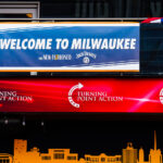 Welcome to Milwaukee and Turning Point Action signage across from the Fiserv Forum. The forum is hosting the 2024 Republican National Convention.