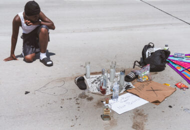 Carlos Davis at a memorial in Milwaukee where Samuel Sharpe Jr. was killed by Columbus Police. Milwaukee Police has said 5 Columbus officers, who are in town for the RNC, shot the man after they witnessed an altercation with another man in which Sharpe refused to drop a knife.