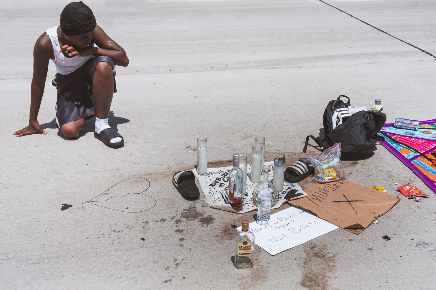 Carlos Davis at a memorial in Milwaukee where Samuel Sharpe Jr. was killed by Columbus Police. Milwaukee Police has said 5 Columbus officers, who are in town for the RNC, shot the man after they witnessed an altercation with another man in which Sharpe refused to drop a knife.