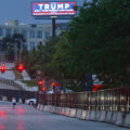 A Trump billboard outside the RNC security fencing hours after an assassination attempt in Pennsylvania.