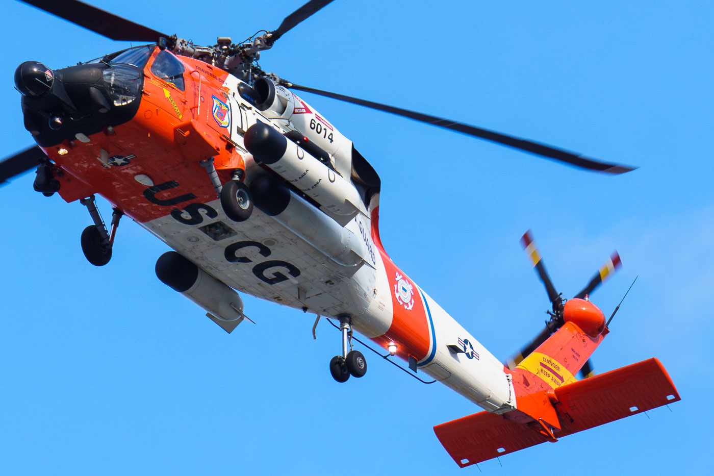 A United States Coast Guard helicopter flies over the Summerfest grounds in Milwaukee where a RNC welcome party is taking place.