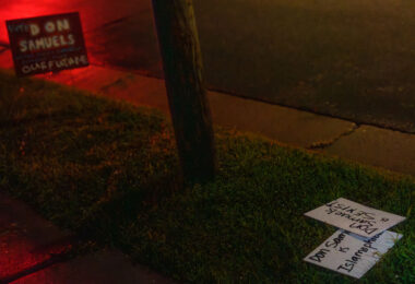 Yard signs mentioning Don Samuels laying next to a Don Samuels yard sign in Minneapolis.