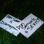 Yard signs mentioning Don Samuels laying next to a Don Samuels yard sign in Minneapolis.