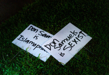 Yard signs mentioning Don Samuels laying next to a Don Samuels yard sign in Minneapolis.