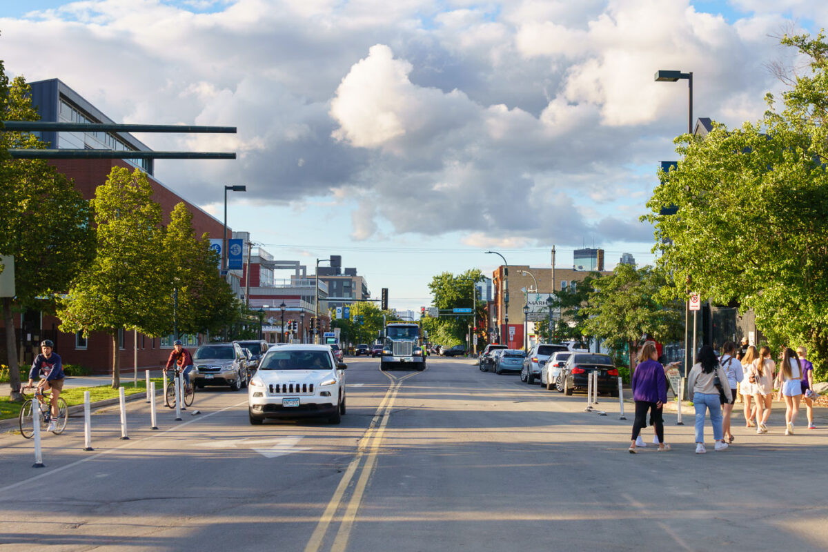 Bikers and walkers on Nicollet Ave/Eat Street in South Minneapolis.