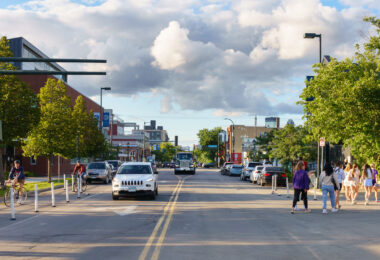 Bikers and walkers on Nicollet Ave/Eat Street in South Minneapolis.