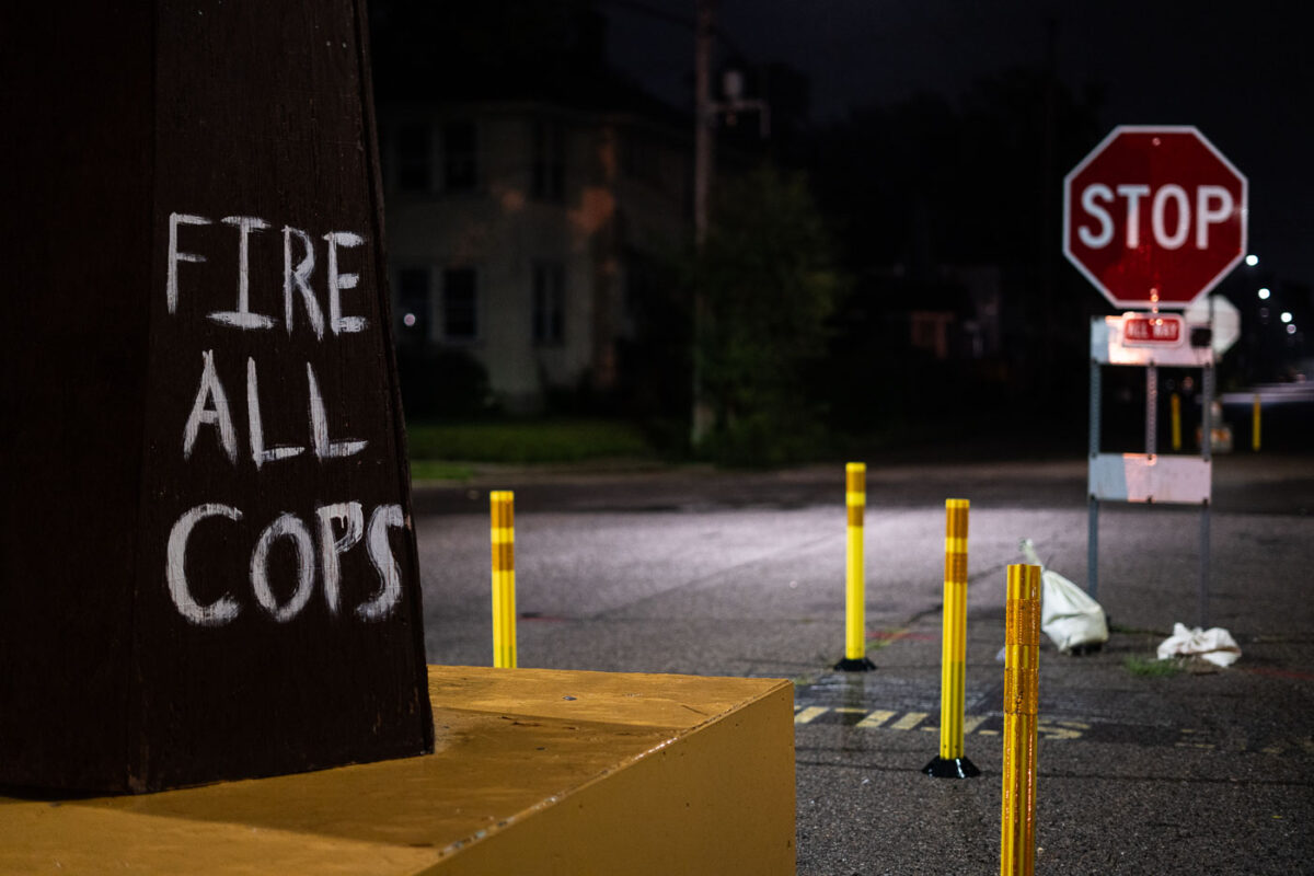 "Fire All Cops" written on a fist at George Floyd Square in South Minneapolis.