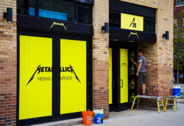 Window wrap going up on Hennepin Ave for a Metallica pop-up store. The band headlines two nights at US Bank Stadium this weekend.