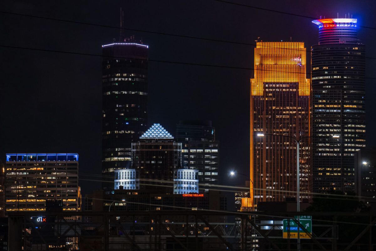 A red white and blue Capella Tower in Downtown Minneapolis tonight as the state waits to see if their Governor Tim Walz will be on the 2024 presidential ticket. (Minneapolis, August 2024)