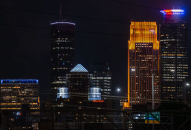 A red white and blue Capella Tower in Downtown Minneapolis tonight as the state waits to see if their Governor Tim Walz will be on the 2024 presidential ticket. (Minneapolis, August 2024)