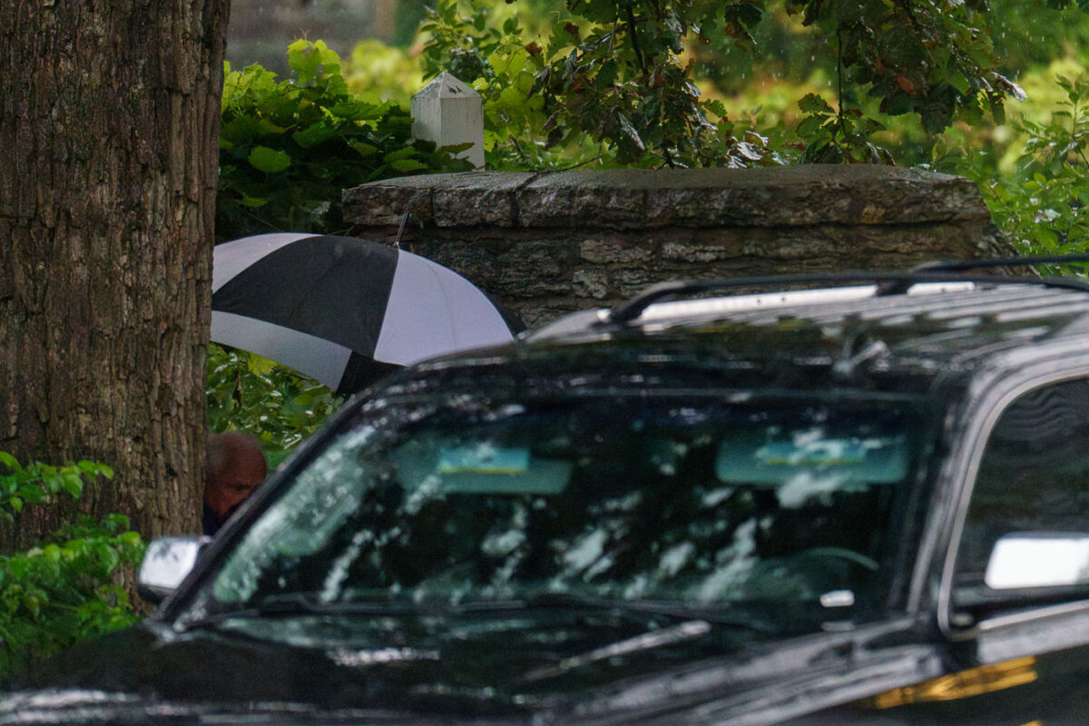 Minnesota Governor Tim Walz and family leave his Eastcliff residence under heavy rain. There is "Reception with Tim Walz" "Harris Victory Fund" event near downtown Minneapolis tonight.