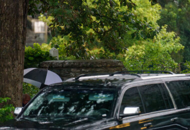 Minnesota Governor Tim Walz and family leave his Eastcliff residence under heavy rain. There is "Reception with Tim Walz" "Harris Victory Fund" event near downtown Minneapolis tonight.