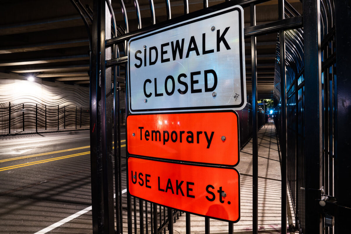 Layers of fencing up around the sidewalk on E 31st Street in Minneapolis. Fencing went up in stages after people pitches tents under the bridge.