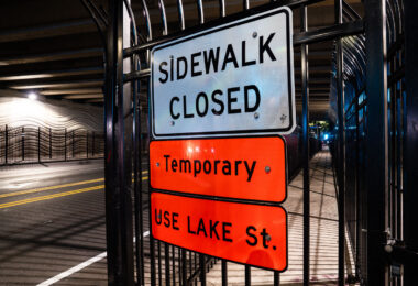 Layers of fencing up around the sidewalk on E 31st Street in Minneapolis. Fencing went up in stages after people pitches tents under the bridge.