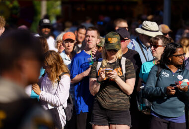 Woman wearing a Harris Walz hat at the Minnesota State Fair in September 2024.