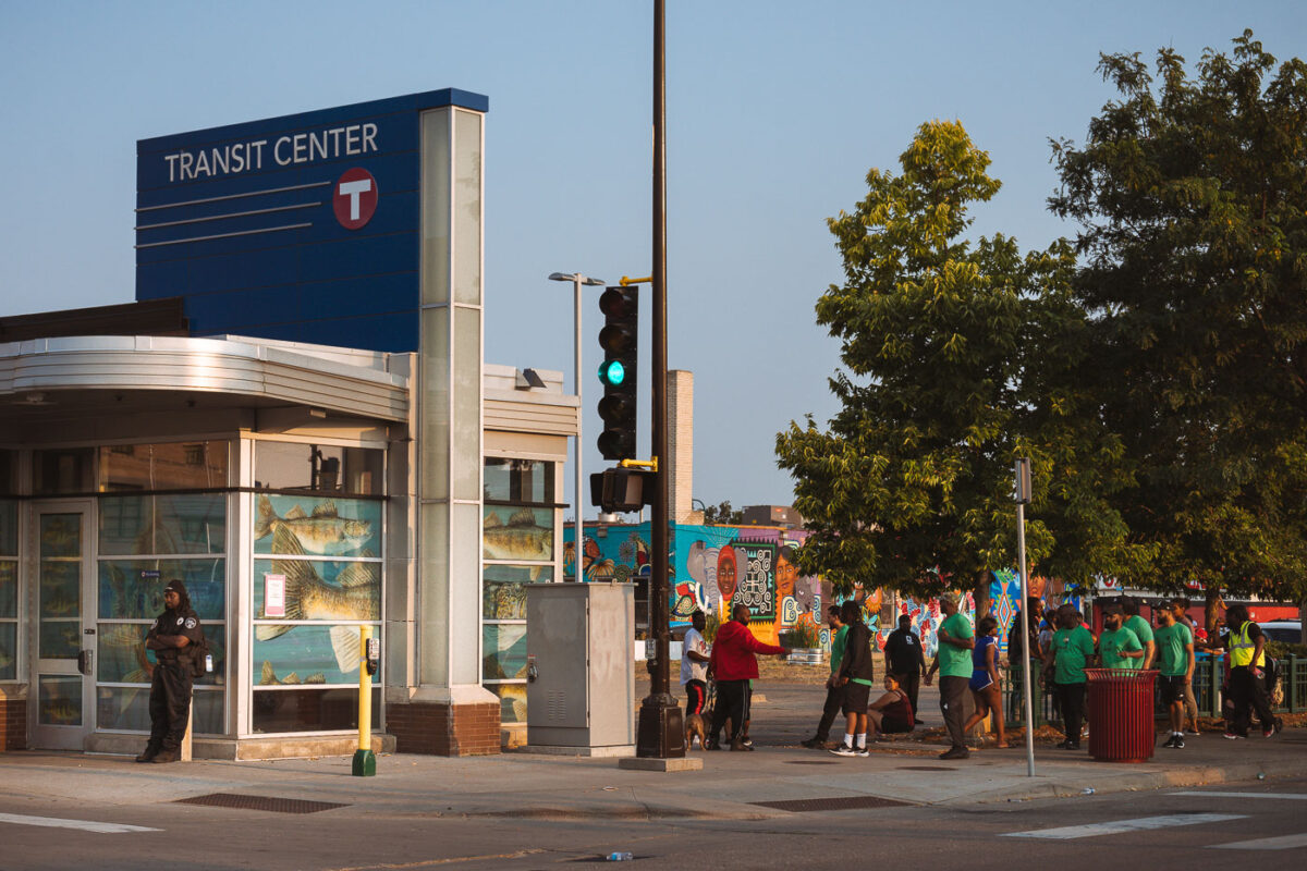 MAD DADs violence interrupters walk past the Midtown Transit Center on Chicago Avenue in Minneapolis.