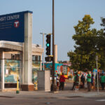 MAD DADs violence interrupters walk past the Midtown Transit Center on Chicago Avenue in Minneapolis.