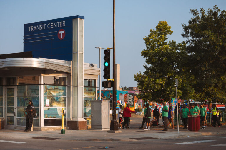 Mad Dads Violence Interrupters in Minneapolis 1 MAD DADs violence interrupters walk past the Midtown Transit Center on Chicago Avenue in Minneapolis.
