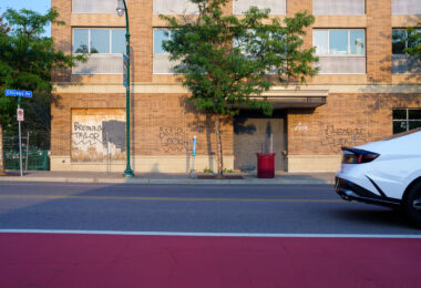 Breonna Taylor, Amir Locke, Ricky Cobb, and George Floyd written on the former Midtown Sheraton on Chicago Avenue in Minneapolis.