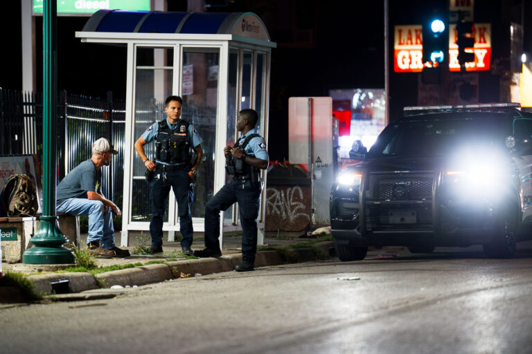 Minneapolis Police Officers on Lake Street 3 Minneapolis police speak to a man on Lake Street in South Minneapolis.