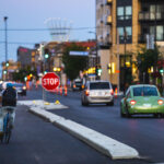 A biker on a brand new bike lane on Lake Street in Uptown Minneapolis.