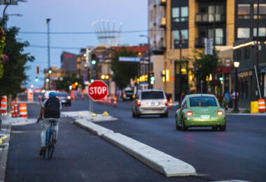 A biker on a brand new bike lane on Lake Street in Uptown Minneapolis.