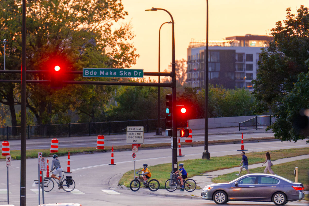 Bikers crossing Lake Street at Bde Maka Ska Drive on the last day of summer. (South Minneapolis, September 2024)