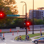 Bikers crossing Lake Street at Bde Maka Ska Drive on the last day of summer. (South Minneapolis, September 2024)
