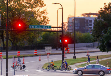 Bikers crossing Lake Street at Bde Maka Ska Drive on the last day of summer. (South Minneapolis, September 2024)