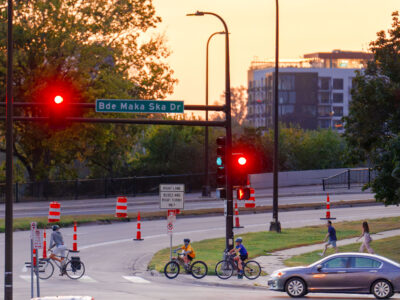 Bikers at Lake Street and Bde Maka Ska Drive, Minneapolis