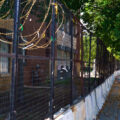 Razor wire and concrete barricades continue to surround the former Minneapolis police 3rd precinct police station. The station was burned by protesters in May 2020 and is being renovated into an community voting center.