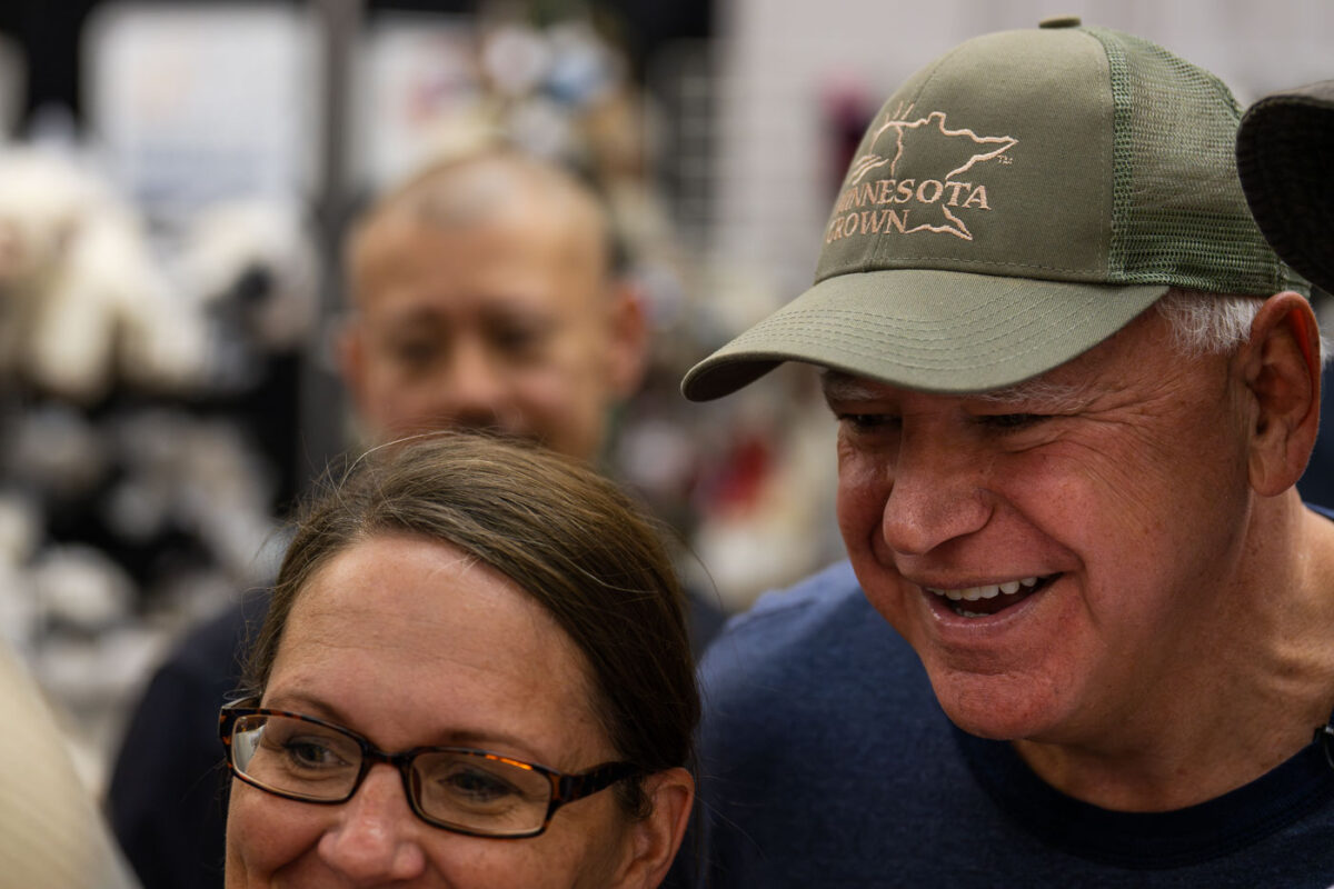 Vice Presidential Candidate and Minnesota Governor Tim Walz takes selfies at the Minnesota State Fair on September 1, 2024.