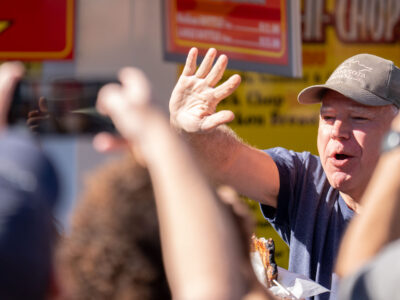 Tim Walz eats pork chop at Minnesota State Fair