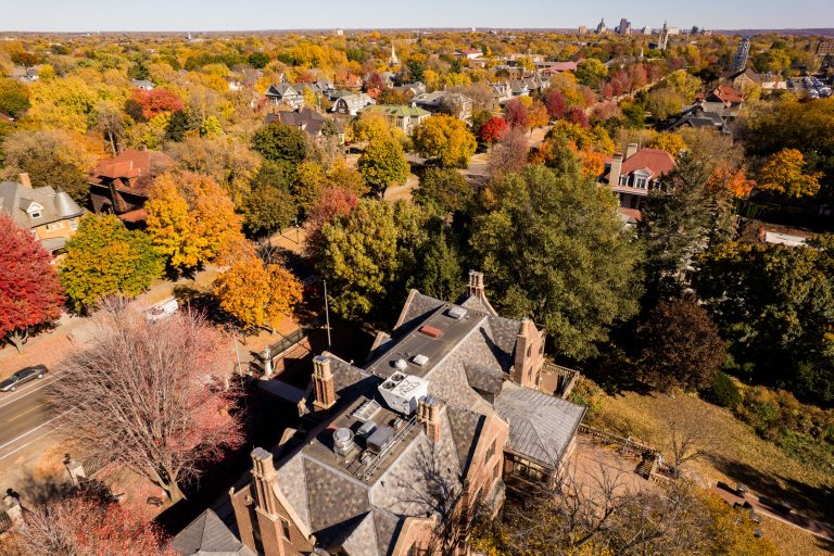 Minnesota Governor's Residence, Summit Avenue, Saint Paul 2 Aerial view of a residential mansion surrounded by autumn foliage in a Midwestern neighborhood.