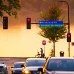 Biker stops in front of Bde Maka Ska in South Minneapolis. As seen from 36th Street.