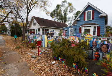 Political yard signs on the fence in front of a home in South Minneapolis prior to 2024 Presidential Election.