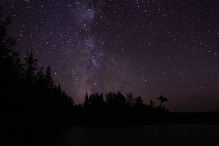 Milky Way Over Superior National Forest, Minnesota 1 The Milky Way galaxy is visible over the dark treeline of Superior National Forest, Minnesota, a protected wilderness area known for its minimal light pollution.
