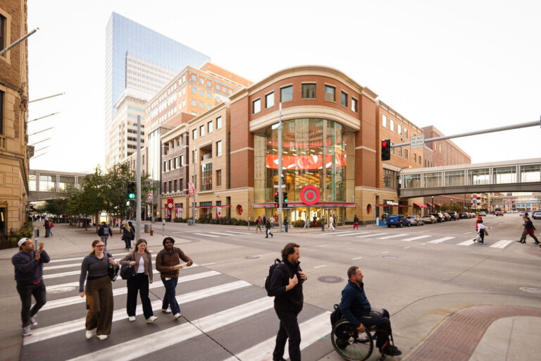 Target Store on Nicollet Mall, Downtown Minneapolis 2 The Target store on Nicollet Mall in Downtown Minneapolis is a prominent retail establishment located on a key urban thoroughfare. Nicollet Mall itself is a pedestrian-oriented street that serves as a central hub for commerce and public life in Minneapolis. This particular Target store, with its modern architecture and prominent signage, reflects the ongoing development and commercial activity within the downtown core. The presence of skyways, visible connecting buildings, indicates Minneapolis's characteristic urban design, facilitating pedestrian movement regardless of weather conditions.