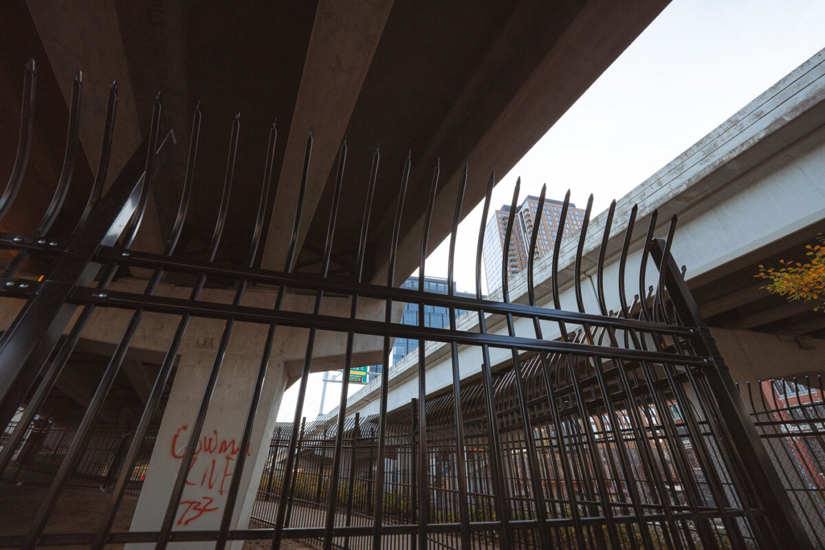 New fencing dropped in the North Loop on N 5th Ave and I-94. It's too bad, was a fun spot to watch trains.  Could see the Light Rail, Northstar Line and freight trains from under this bridge.