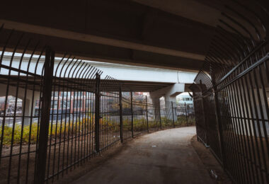 New fencing dropped in the North Loop on N 5th Ave and I-94. It's too bad, was a fun spot to watch trains.  Could see the Light Rail, Northstar Line and freight trains from under this bridge.