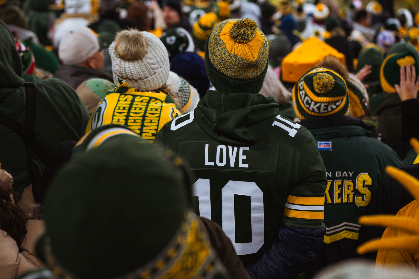 Fan wears Jordan Love jersey at the game