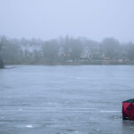Ice fishing on the Lake of the isles on an unusually warm December evening.