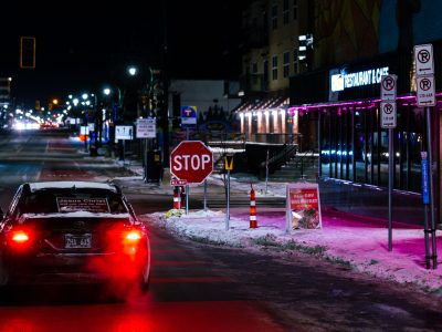 Jesus Christ sign on car, Lake Street, Minneapolis at night