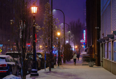 A jogger in the snow on Washington Avenue in the North Loop near Bunkers Bar & Grill.