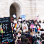 February, 5 2025 Protest against Trump and Musk in Minnesota 4 Hundreds gathered on the steps of the Minnesota State Capitol in St. Paul on February 5, 2025, as part of the nationwide 50501 Movement — fifty coordinated protests across all fifty states. Demonstrators carried handmade signs calling for the protection of democracy and denouncing Project 2025, a controversial conservative policy blueprint that critics warned could undermine civil rights and government independence. The crowd included students, community organizers, and local officials, unified by concerns over political extremism and voter suppression. In this image, a young protester’s sign — “Look out Trump, my generation votes in the next election” — captures the rally’s tone of urgency, defiance, and generational change.